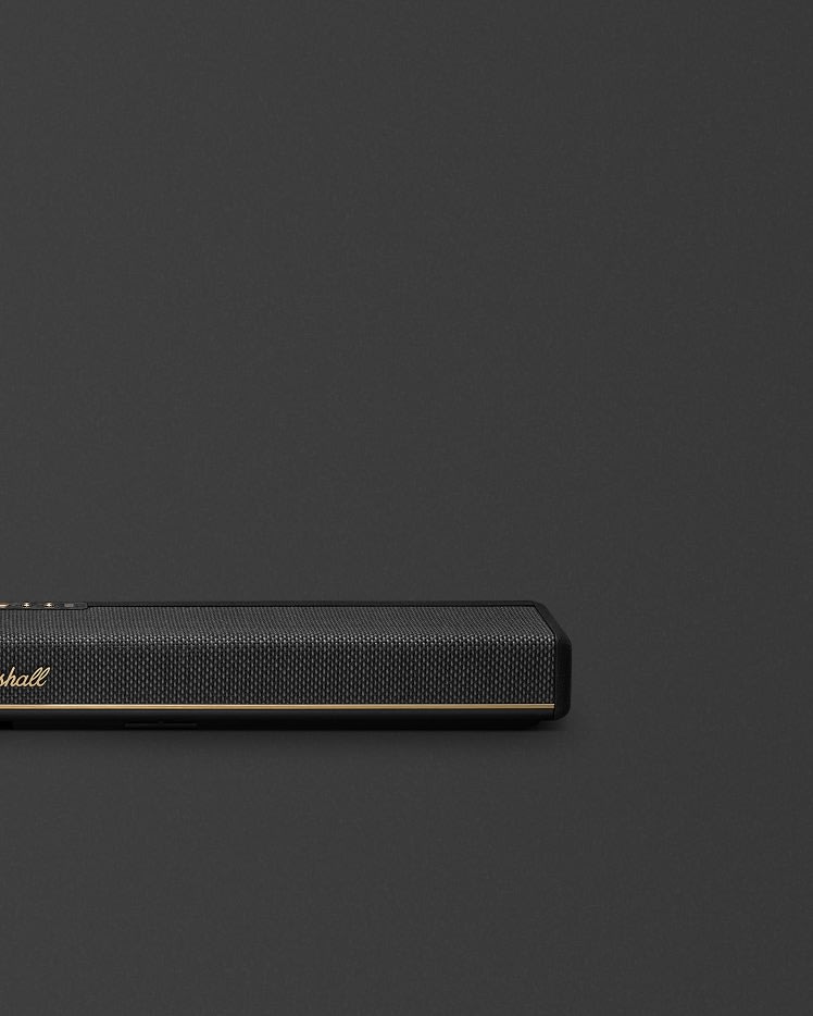 Marshall Heston 60 Black soundbar, featuring a slim black design with gold accents, stands out against a dark background.