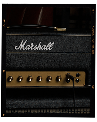 A cable plugged to the Marshall 1987X Vintage Reissue Head amp.