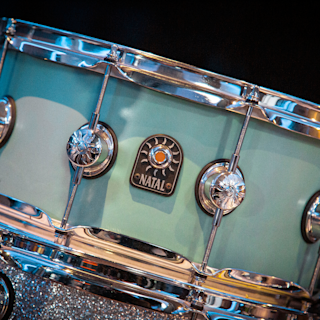 A detailed close-up of a blue snare drum
