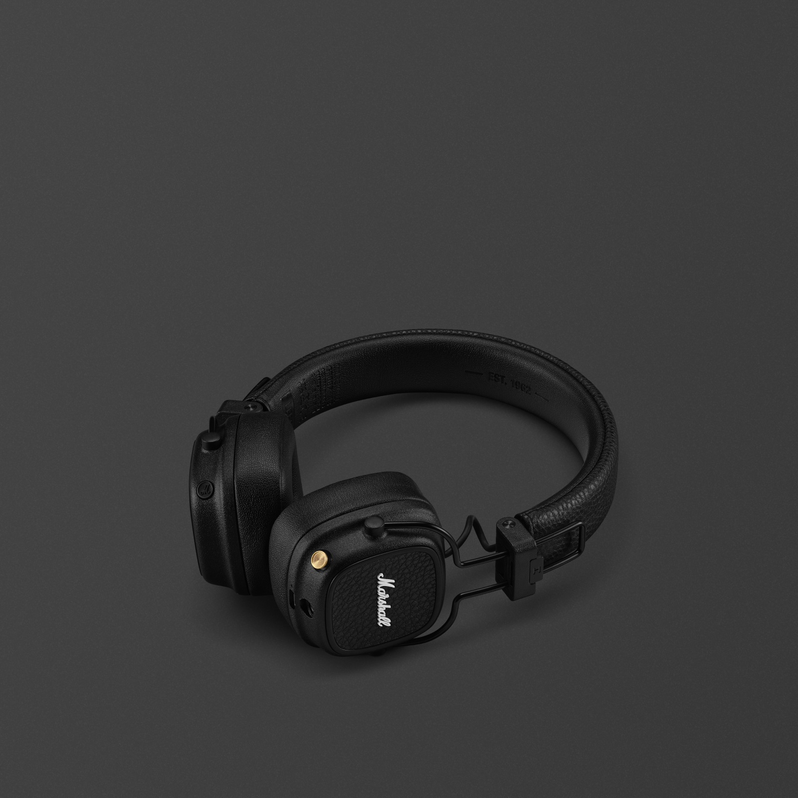 Marshall Major V Black on-ear headphones against a dark background.