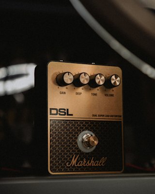 The Marshall DSL Overdrive pedal standing on the ground.