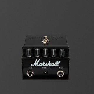 A Marshall Shredmaster guitar effects pedal with four control knobs, a footswitch on top, input and output jacks, and a power socket, against a plain gray background.