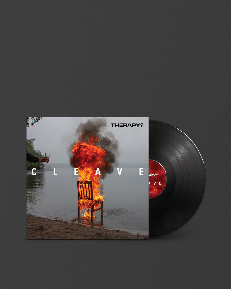 An image of a CLEAVE THERAPY chair engulfed in flames with a Marshall vinyl record player next to it.