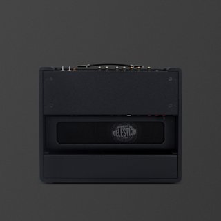 A black Marshall Origin50 guitar amplifier combo is shown from the back, revealing controls on the top panel and a visible Celestion speaker inside the cabinet.