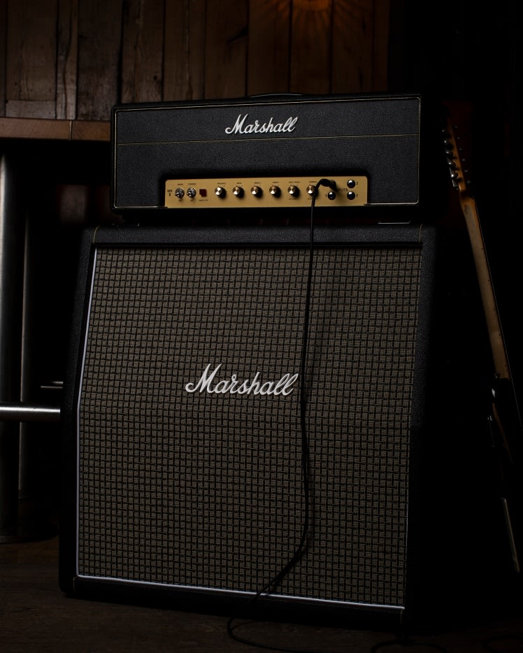 1987X Vintage Reissue Head on top of a Marshall angled amplifier.