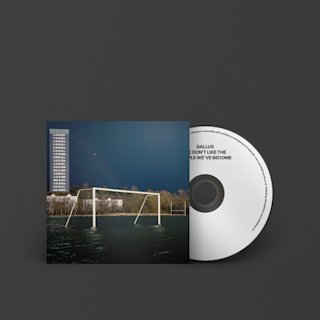 A Marshall CD featuring We Don't Like The People We've Become by Gallus, with a captivating picture of a sprawling soccer field next to a towering skyscraper.