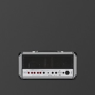 A grey Marshall Studio Jubilee guitar amplifier head is shown from the back, displaying various input/output jacks, switches, and labeling on a plain dark background.
