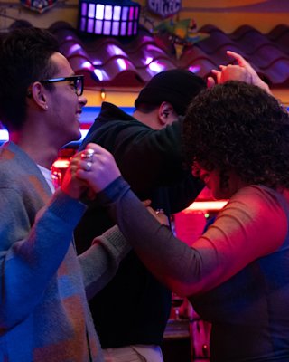 People dancing whilst listening to a music played on the Marshall Jukebox