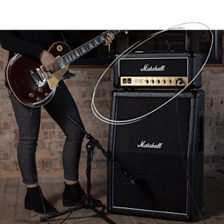 A image highlighting Marshalls Studio Classic Head with a person playing a guitar