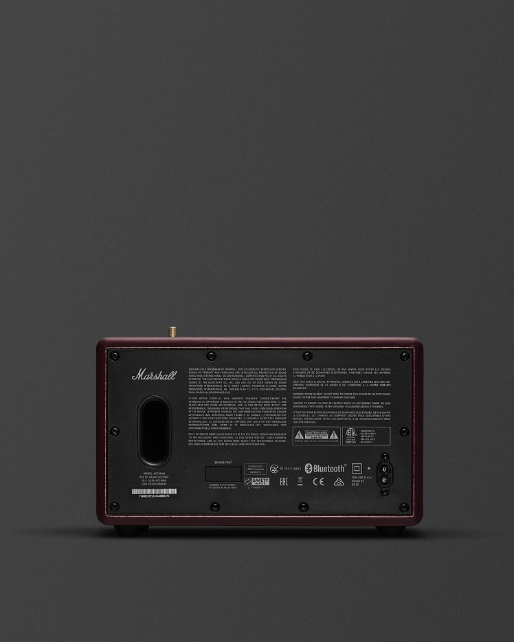 Rear view of a Marshall Acton III Burgundy speaker showing input ports, power switch and labels.