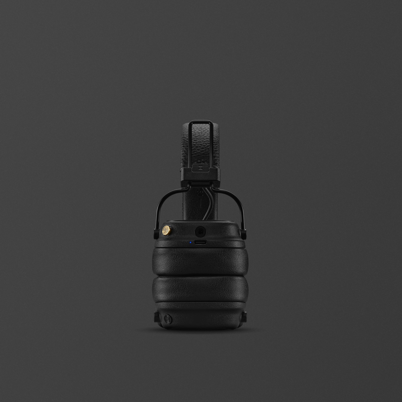 Folded Marshall Major V Black on-ear wireless headphones against a dark background.