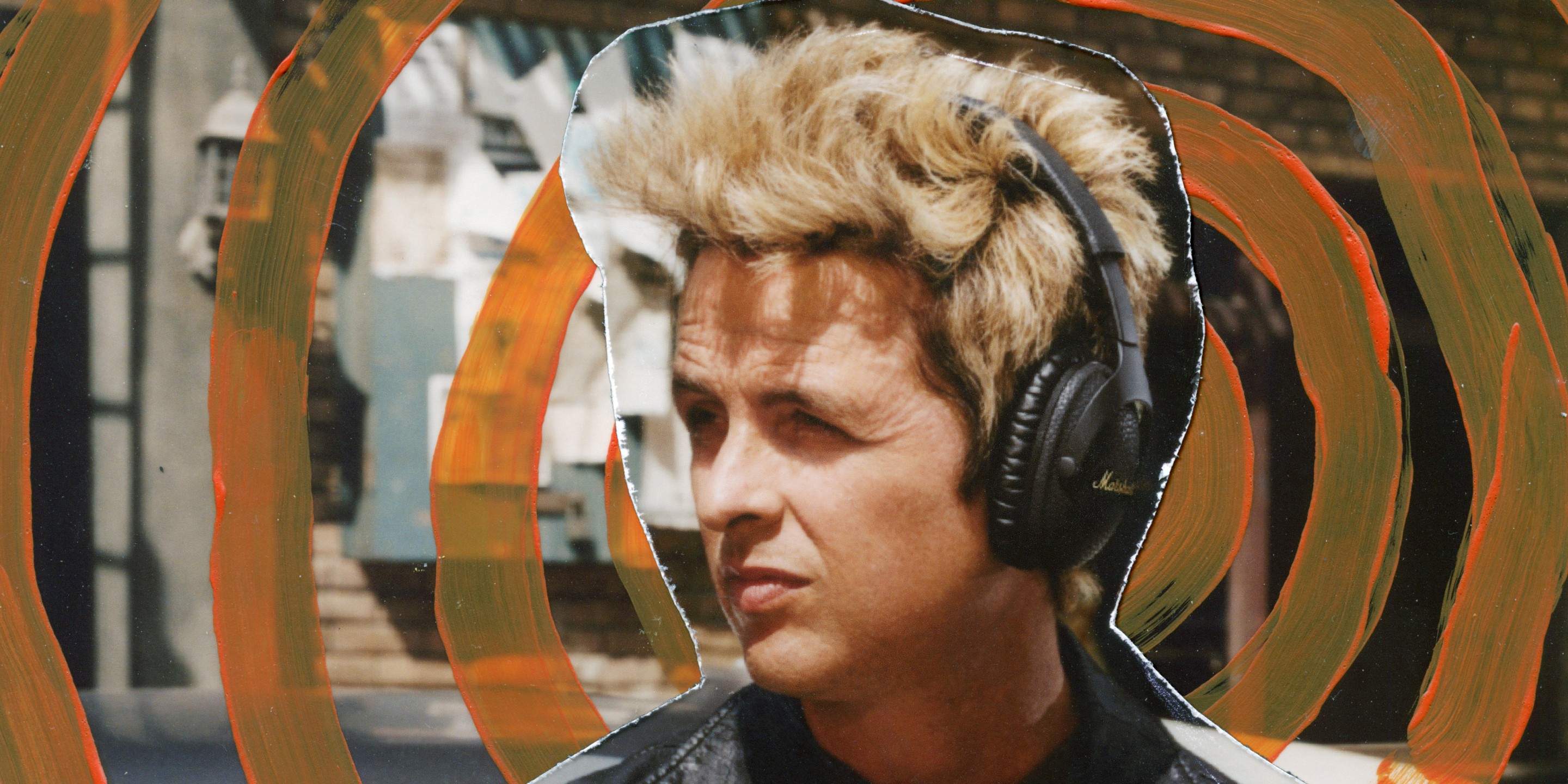 Billie Joe Armstrong looking away whilst listening to music on the Marshall Monitor III A.N.C.