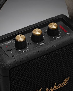 Close-up on Marshall's Stockwell II gold knobs on speaker.