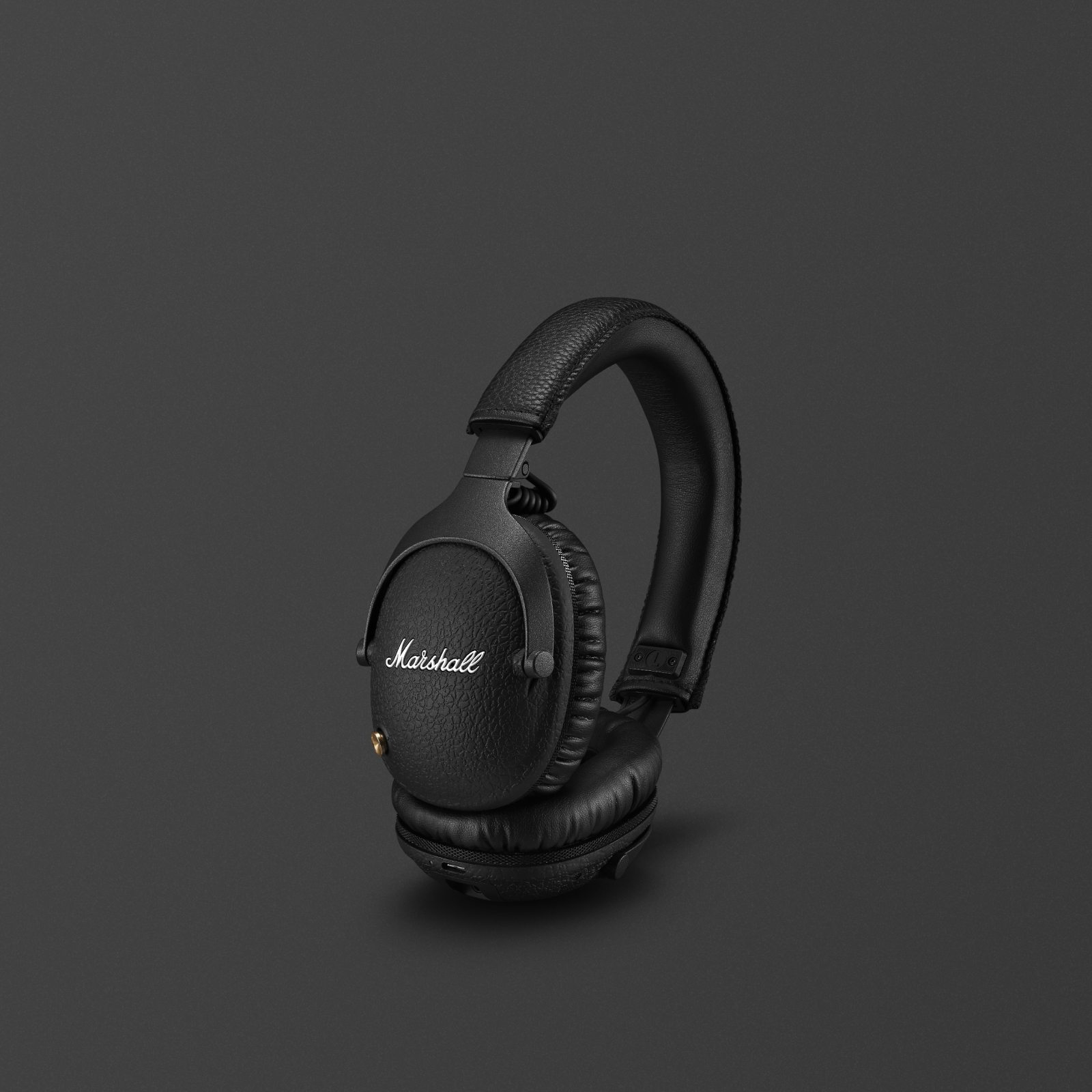 Marshall headphone with microphone on a black background.