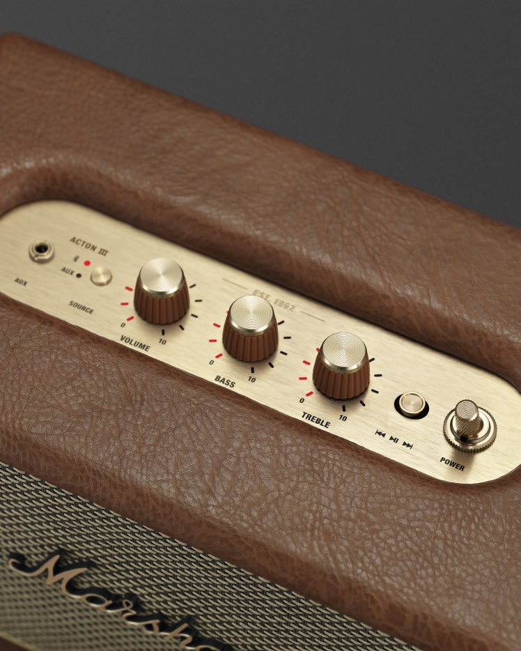 A close up of a brown Marshall ACTON III BROWN speaker with buttons on it.