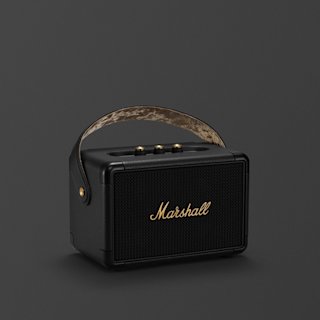 A Marshall Kilburn II portable speaker in Black and Brass, with a brown carrying strap and the brass Marshall logo sits on a dark gray background.
