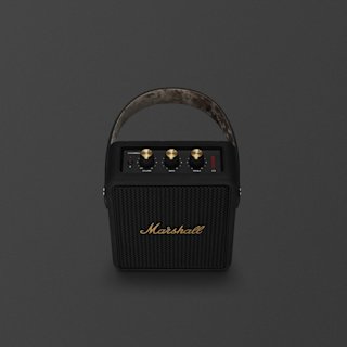 A Marshall Stockwell II portable speaker in Black and Brass with a top handle, brass control knobs, and the Marshall logo on the front, photographed against a dark background.