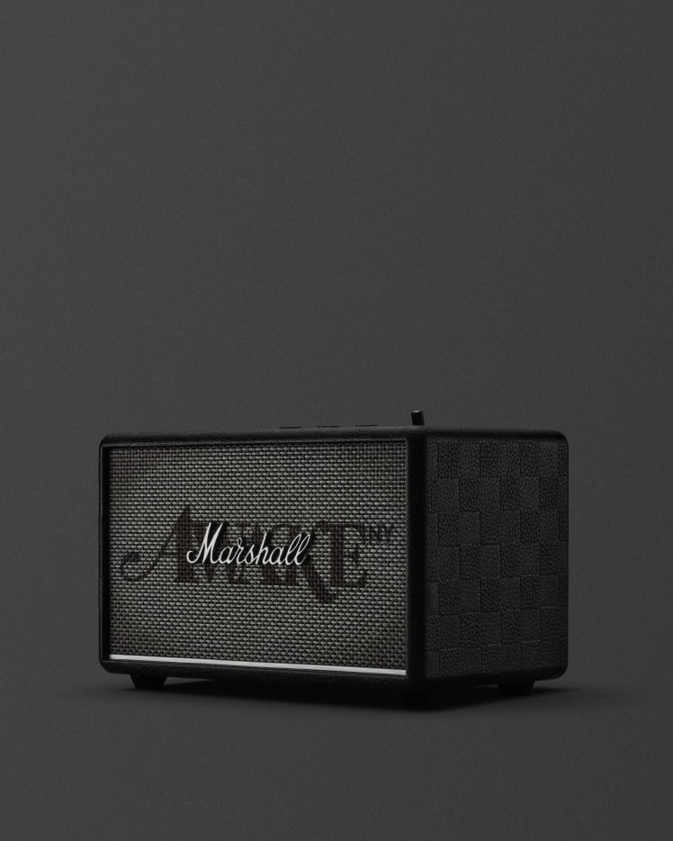 Marshall Acton III Awake NY Edition bluetooth speaker showcases its black color with a checkered pattern.
