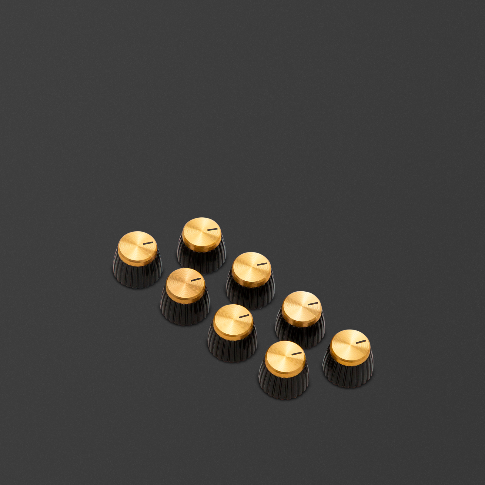 Pack of 8 gold d-shaft knobs where the marker points to the round side of the d-shaft