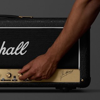 A person adjusting the sound on JCM800 Modified