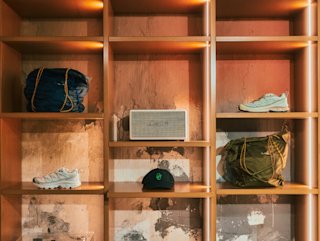A retro red truck parked in front of a brewery.