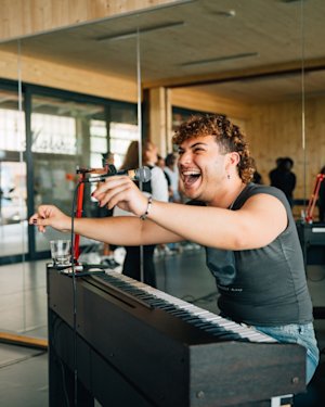 DJ Playing music excitedly in a Roots Berlin event.