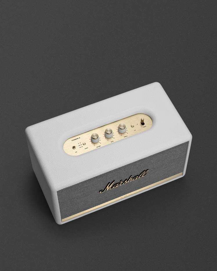 Marshall Stanmore II Bluetooth speaker in cream white with brass control knobs.