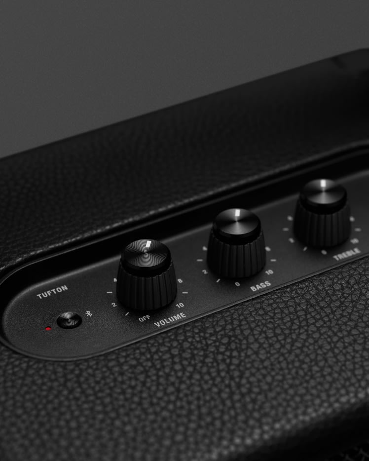 A close up of the control buttons on a black Marshall Tufton Black speaker