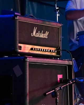 A stack of Marshall JCM800 2203 amplifiers with microphones.