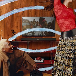 Two people in front of a TV and Marshall Heston 120.