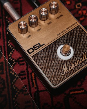 Close-up of a Marshall DSL overdrive pedal.