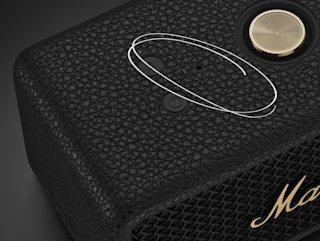 Close-up of the Marshall Emberton III Black and Brass portable speaker featuring a black textured exterior, a gold knob, and three small circular buttons or indicators.