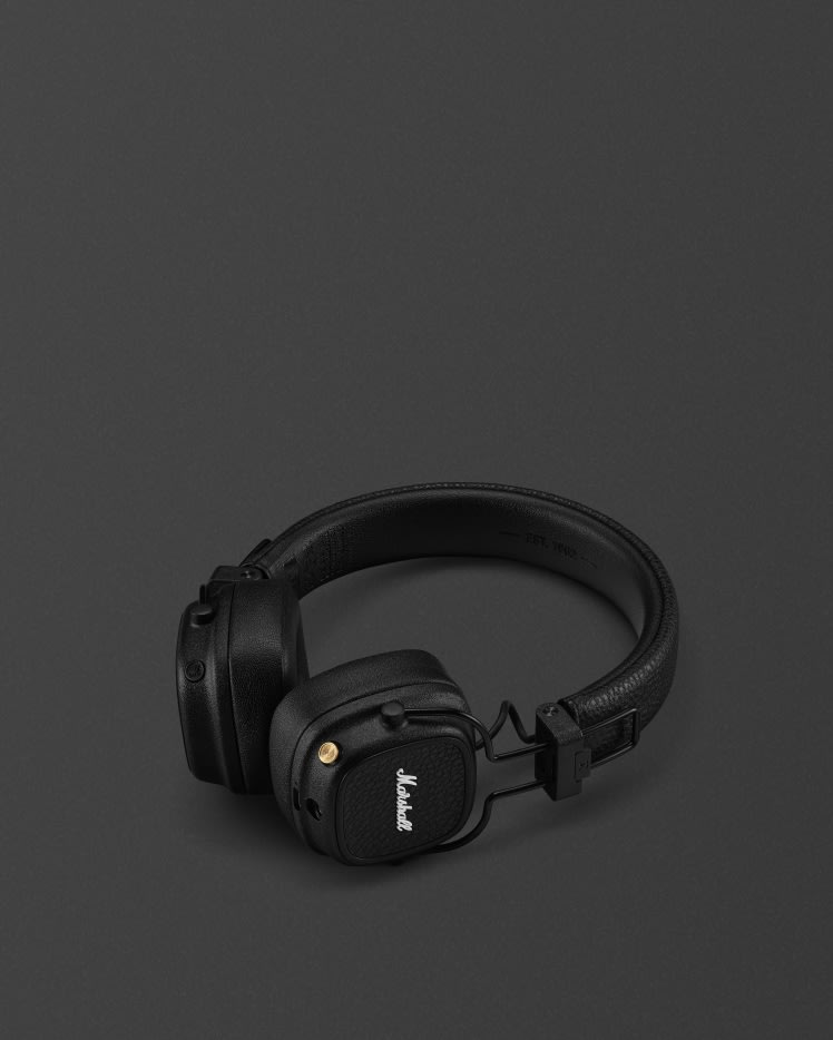Marshall Major V Black on-ear headphones against a dark background.