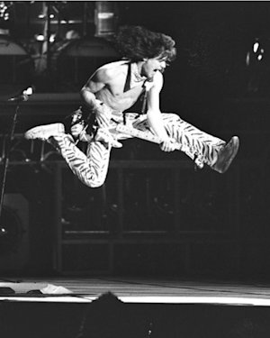 Eddie with his infamous flying guitar kick on stage