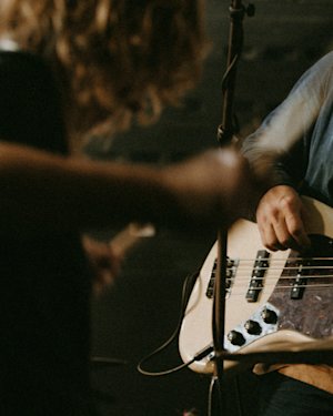 A man plays bass on stage.