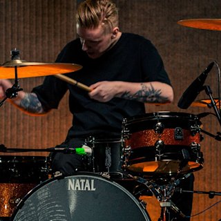 A drummer playing on the Natal snare drum