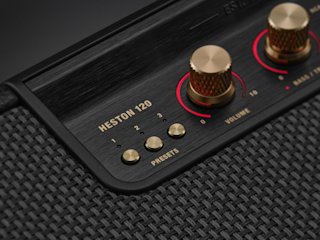 Close-up of a Marshall Heston 120 soundbar speaker with gold control knobs, preset buttons, and volume controls.