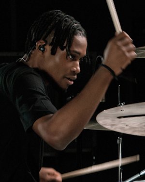 A drummer wearing a Natal drums tshirt