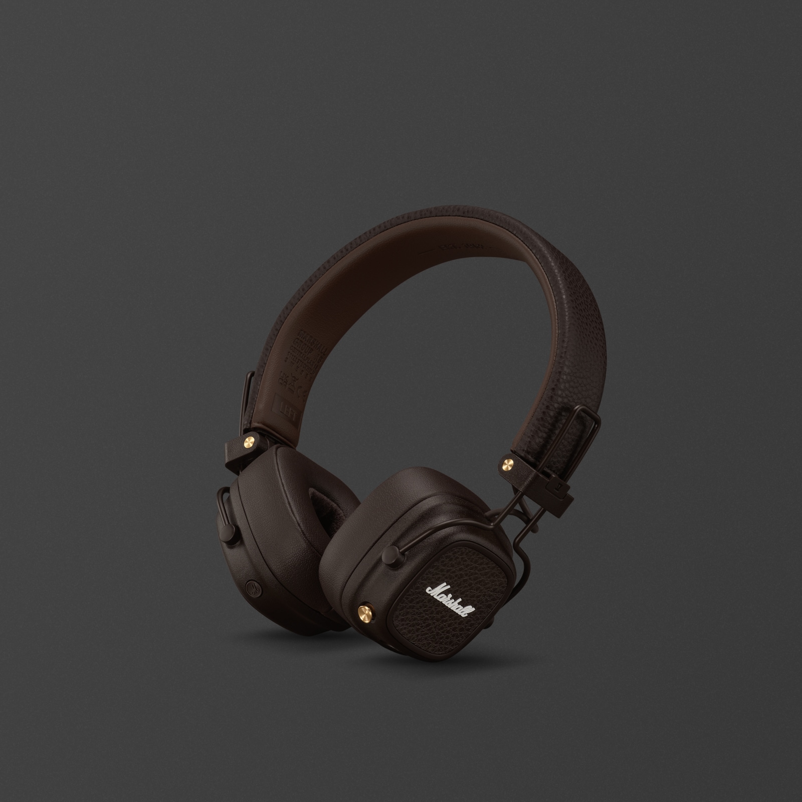 Une paire d'écouteurs supra-auriculaires Marshall Major V Brown sur fond gris foncé.