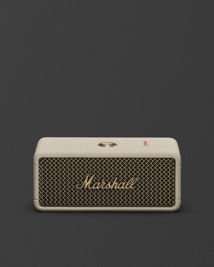 Marshall Emberton III Cream bluetooth speaker, featuring a gold grille and top buttons displayed against a dark background.