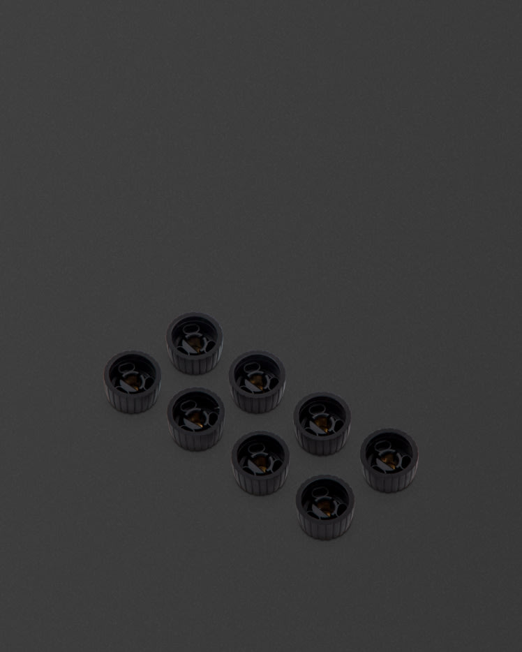 These knobs feature a black body, gold cap, and have a D-shaped push on profile