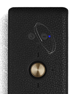 Close-up of Marshall Emberton III Black and Brass bluetooth speaker, featuring a blue indicator light.