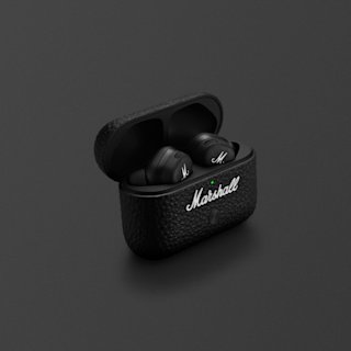 A pair of black Marshall Motif II A.N.C. wireless earbuds in an open textured charging case with the Marshall logo visible, set against a dark background.