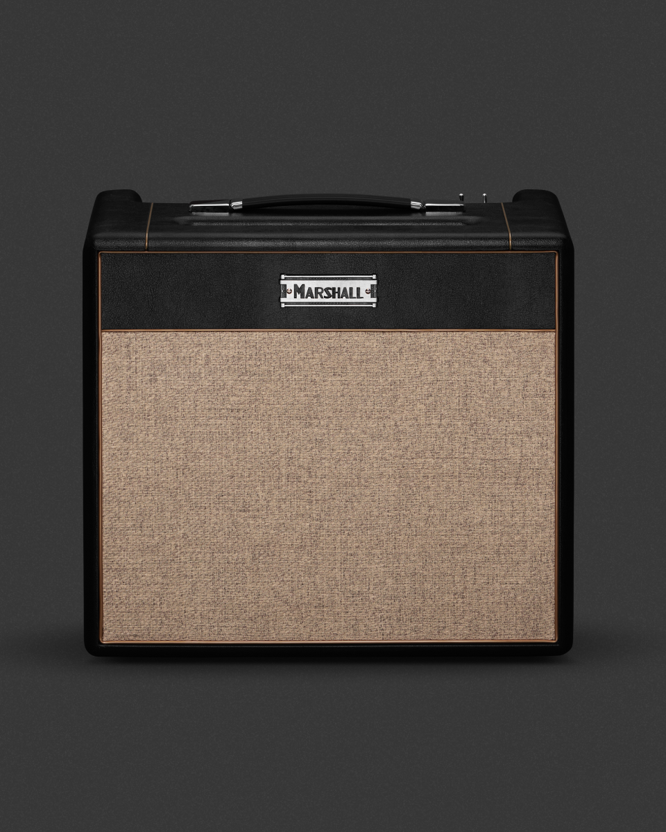 A black and brown guitar amplifier on a black background.