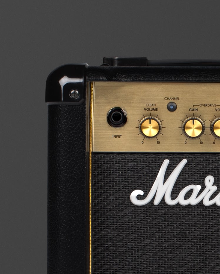 Marshall's MG10 black amplifier with gold knobs.