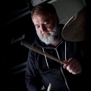 Mathew Priest playing with the drums sticks by Natal drums