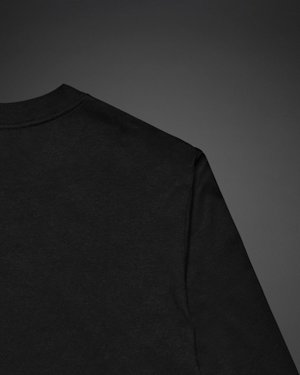 Close-Up of the Standard Issue Long Sleeve T-shirt upper back in black