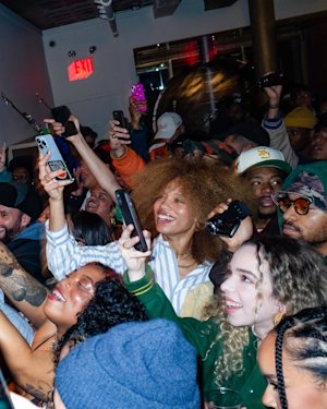 A crowd taking photos in a gathering