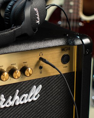 Monitor II A.N.C. headphones connected to the Marshall MG15G Combo.