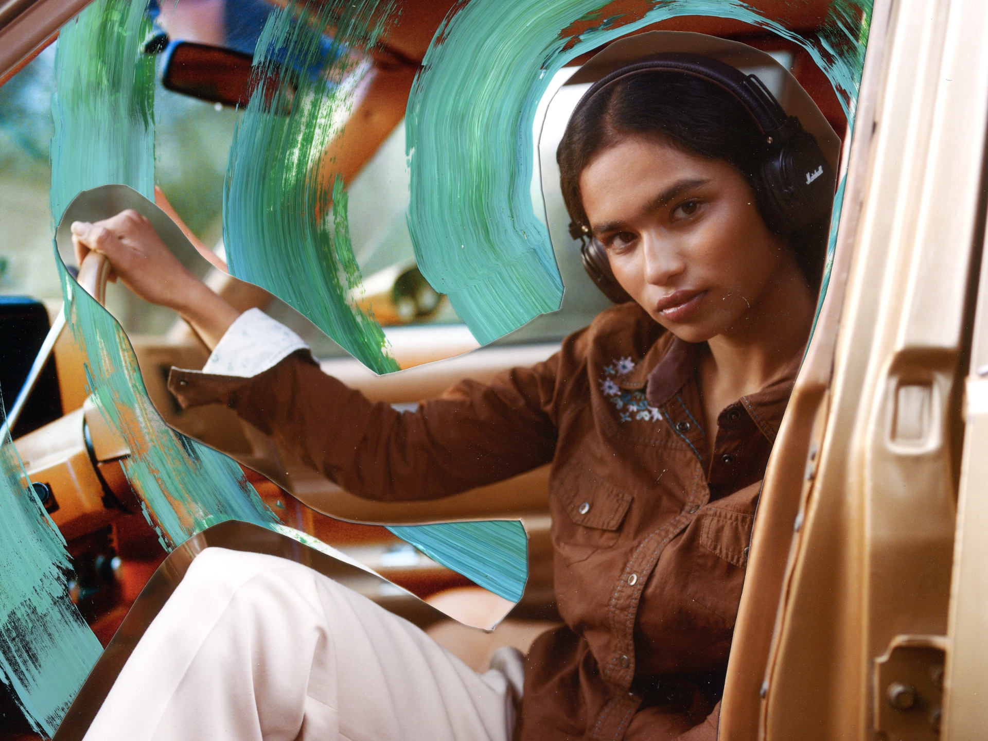 A woman wearing Marshall Major V Brown on-ear bluetooth headphones. 